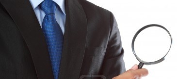 business man with magnifying glass